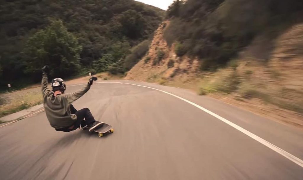 Photo of Brett Ciabattini sliding into a left corner 