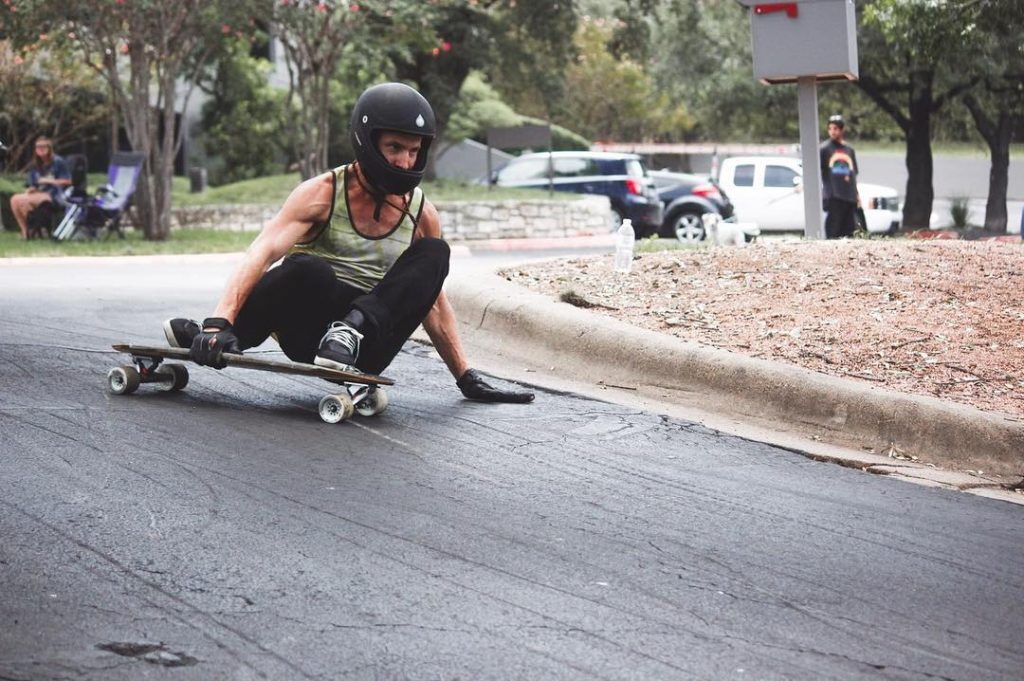 Photo of Liam McSpadden with one hand down through a left turn